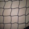Knotless hockey barrier net