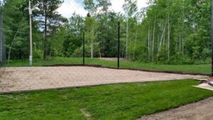 Sand volleyball with a large ball net covering it