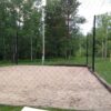 Large ball net around a sand volleyball pit